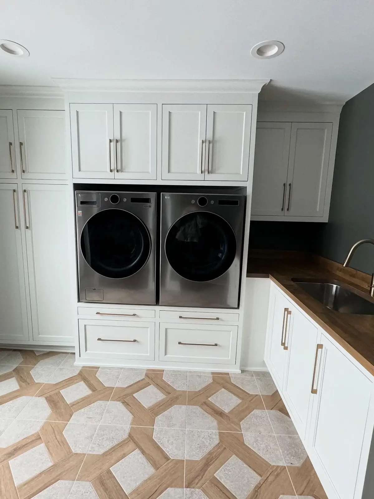 Laundry with stacked washer and dryer