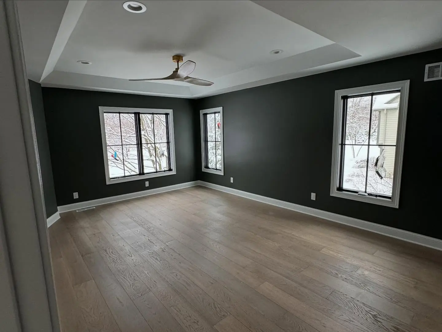 Bedroom with dark accent wall — Broken Bow