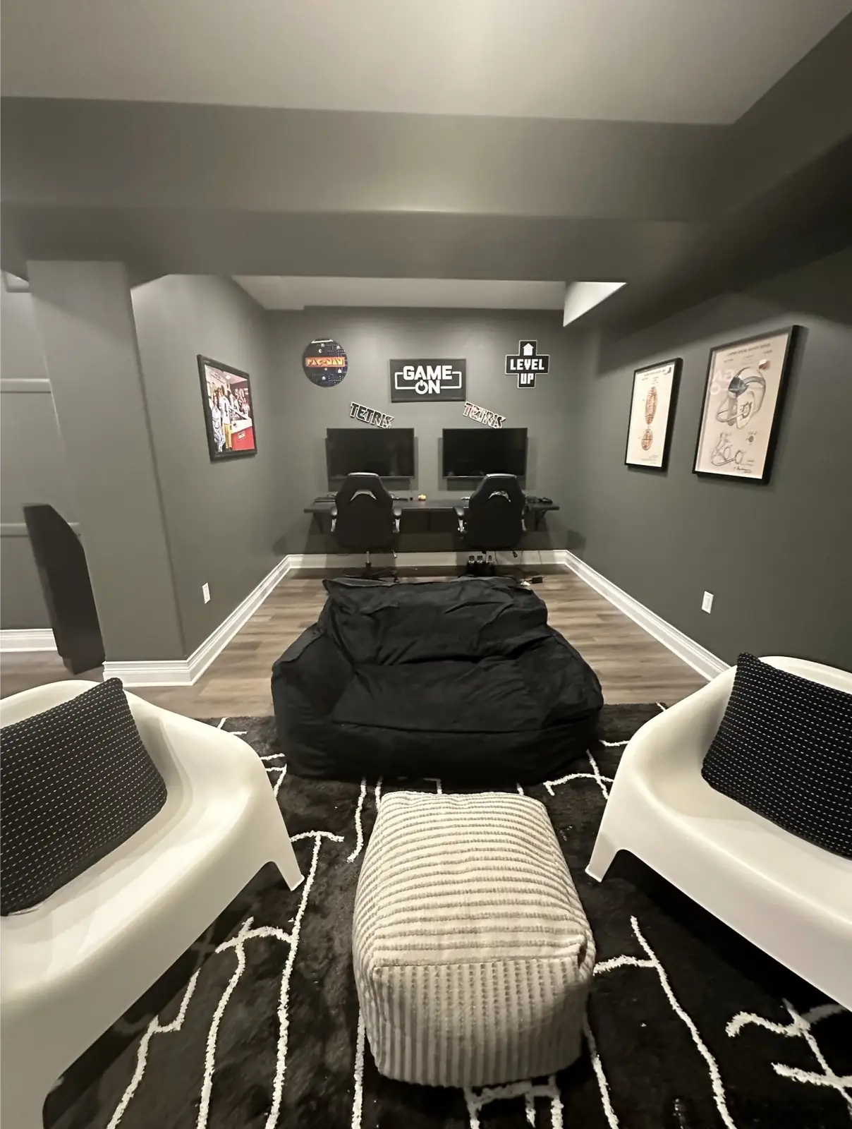 Gaming room after — two gaming stations and lounge chairs