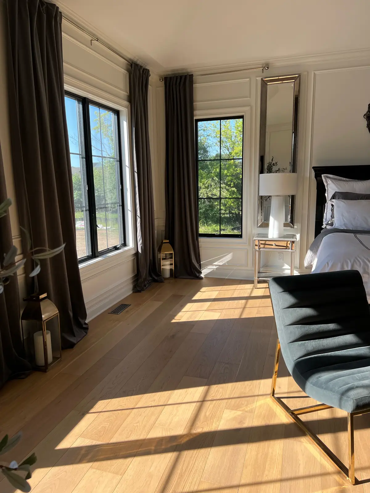 Sunlit windows and floor-length drapes