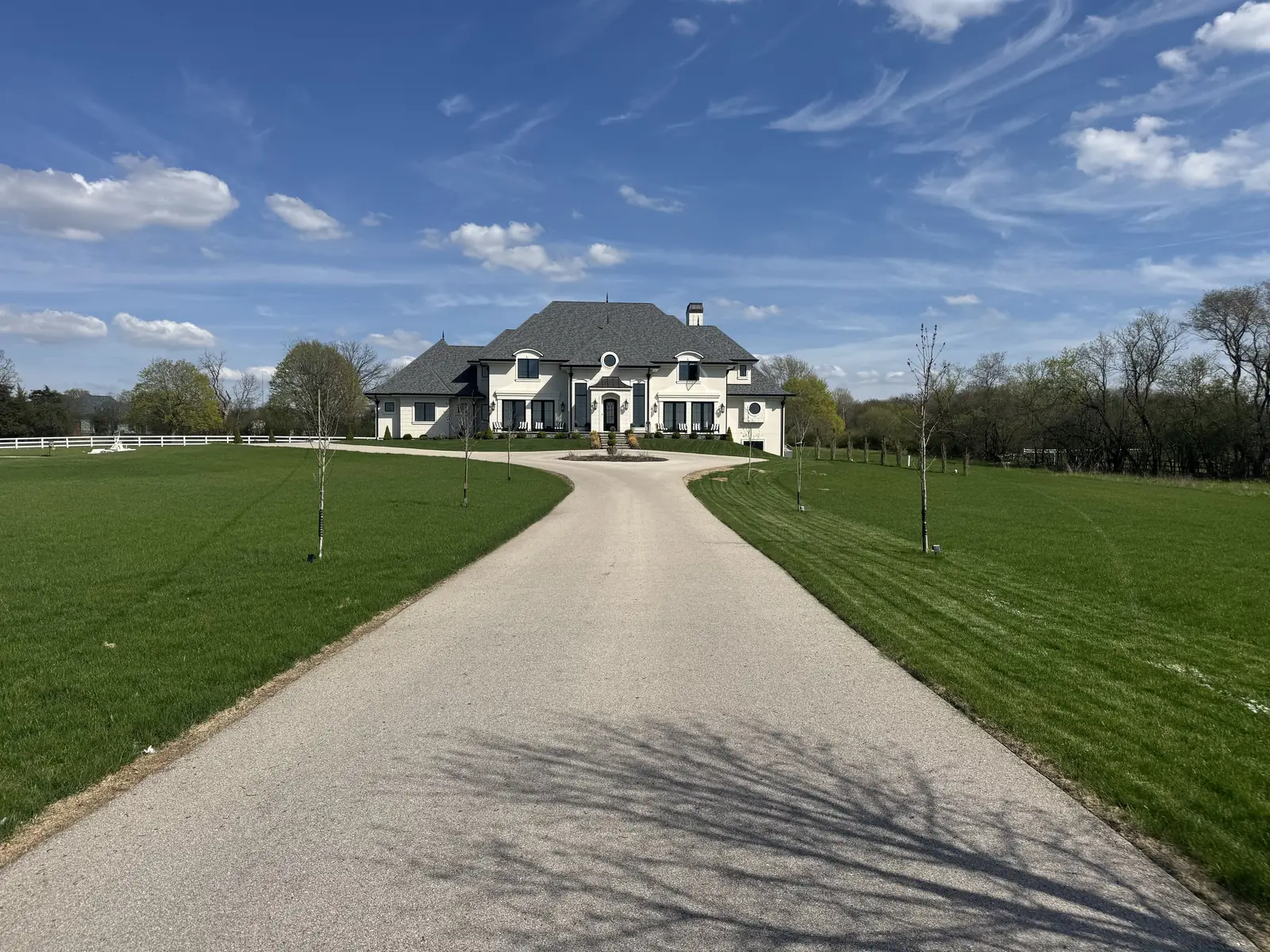 Front elevation and drive — French-Inspired Residence
