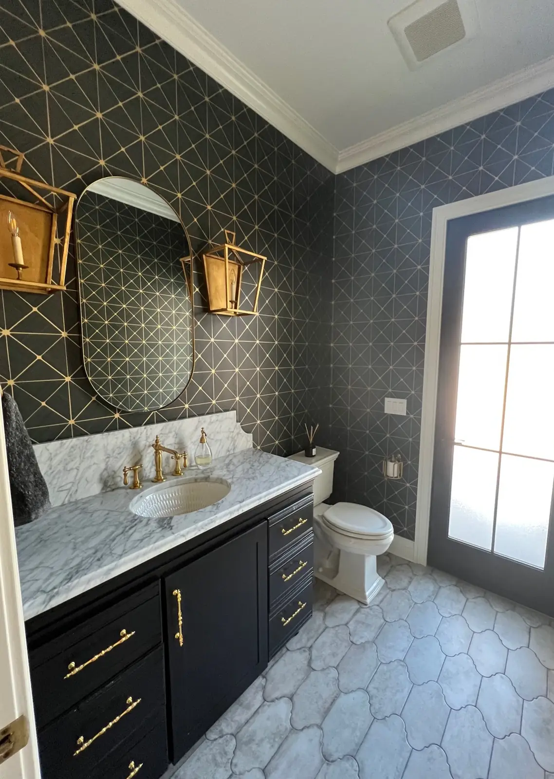 Powder room with black geometric wallpaper — French-Inspired Residence