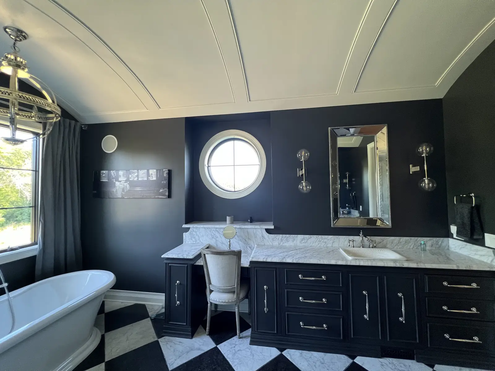 Black vanity over checkerboard marble — French-Inspired Residence