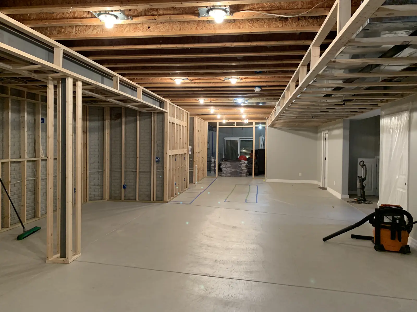 The basement before — a long view down the framing