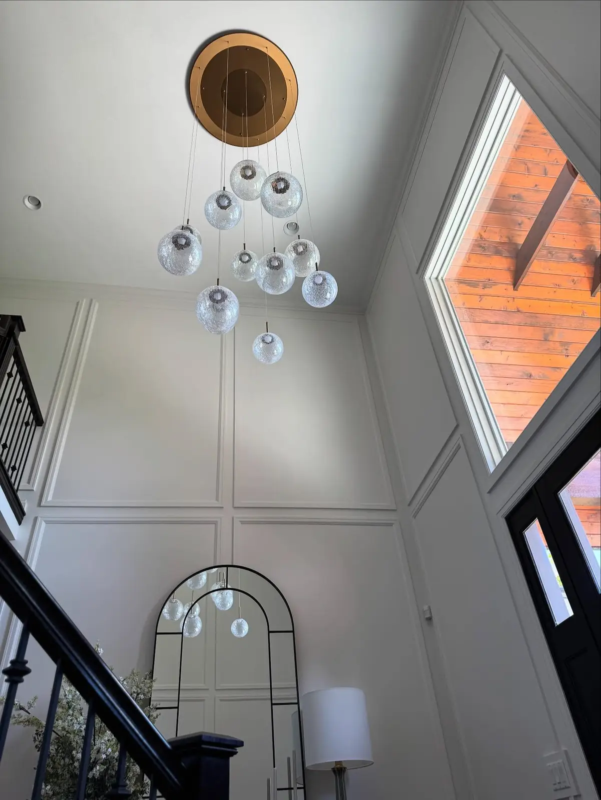 Two-story foyer with a crystal chandelier