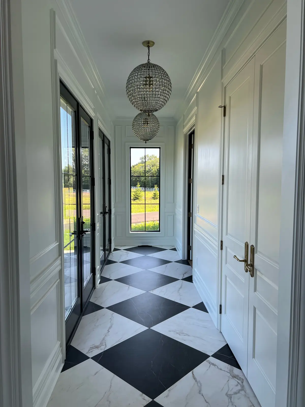 Gallery hall with checkerboard marble — French-Inspired Residence