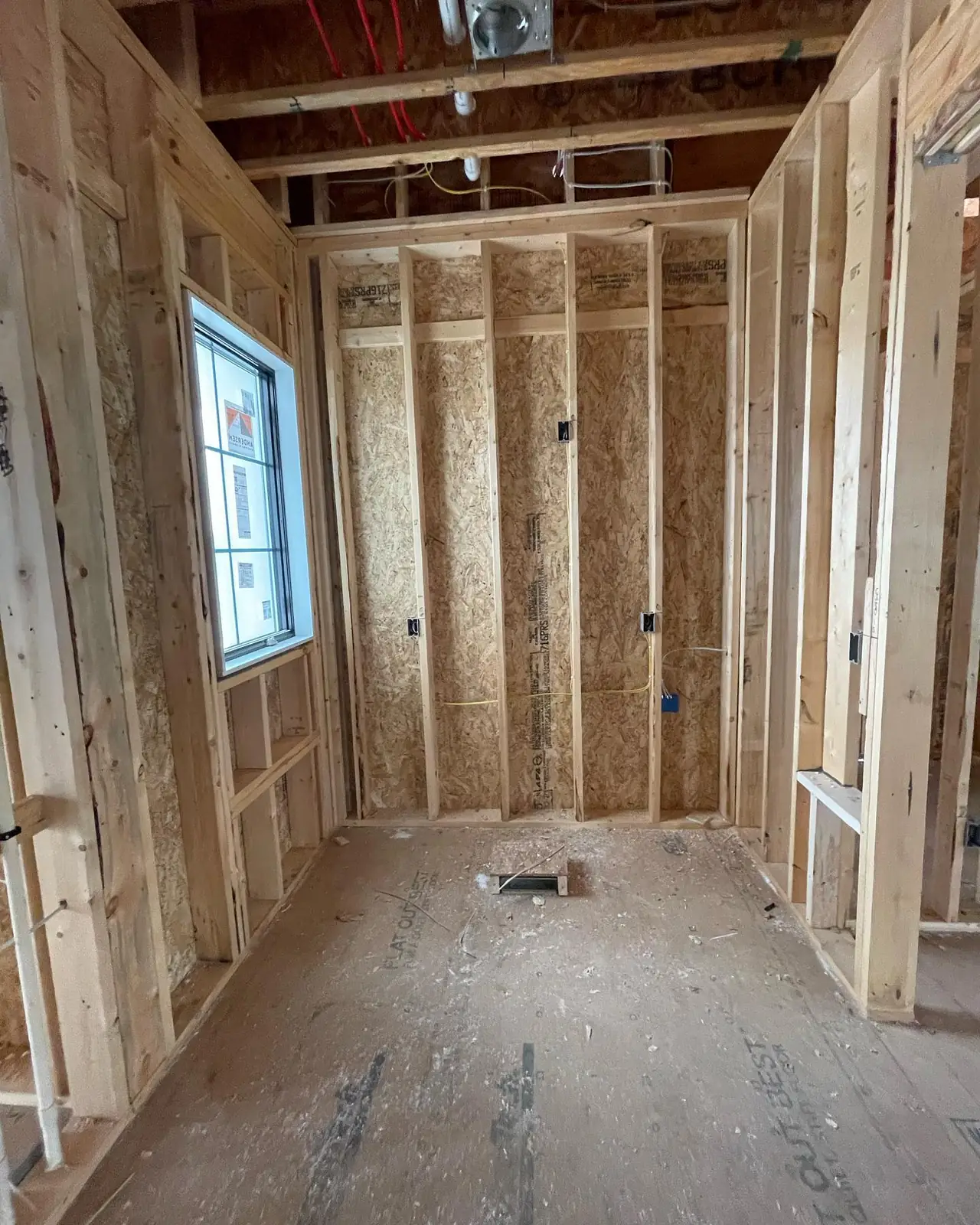 Laundry room before — framing, toward the window wall