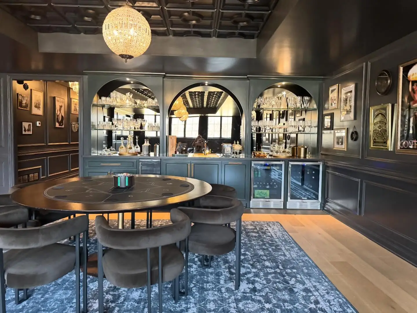 Speakeasy with a round table beneath a coffered ceiling